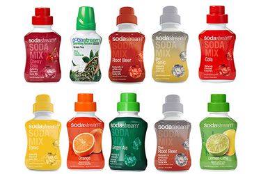 Ten bottles of different soda stream flavors on a white background.