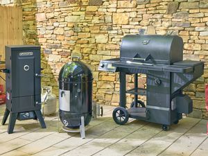 There smokers on an outdoor patio.