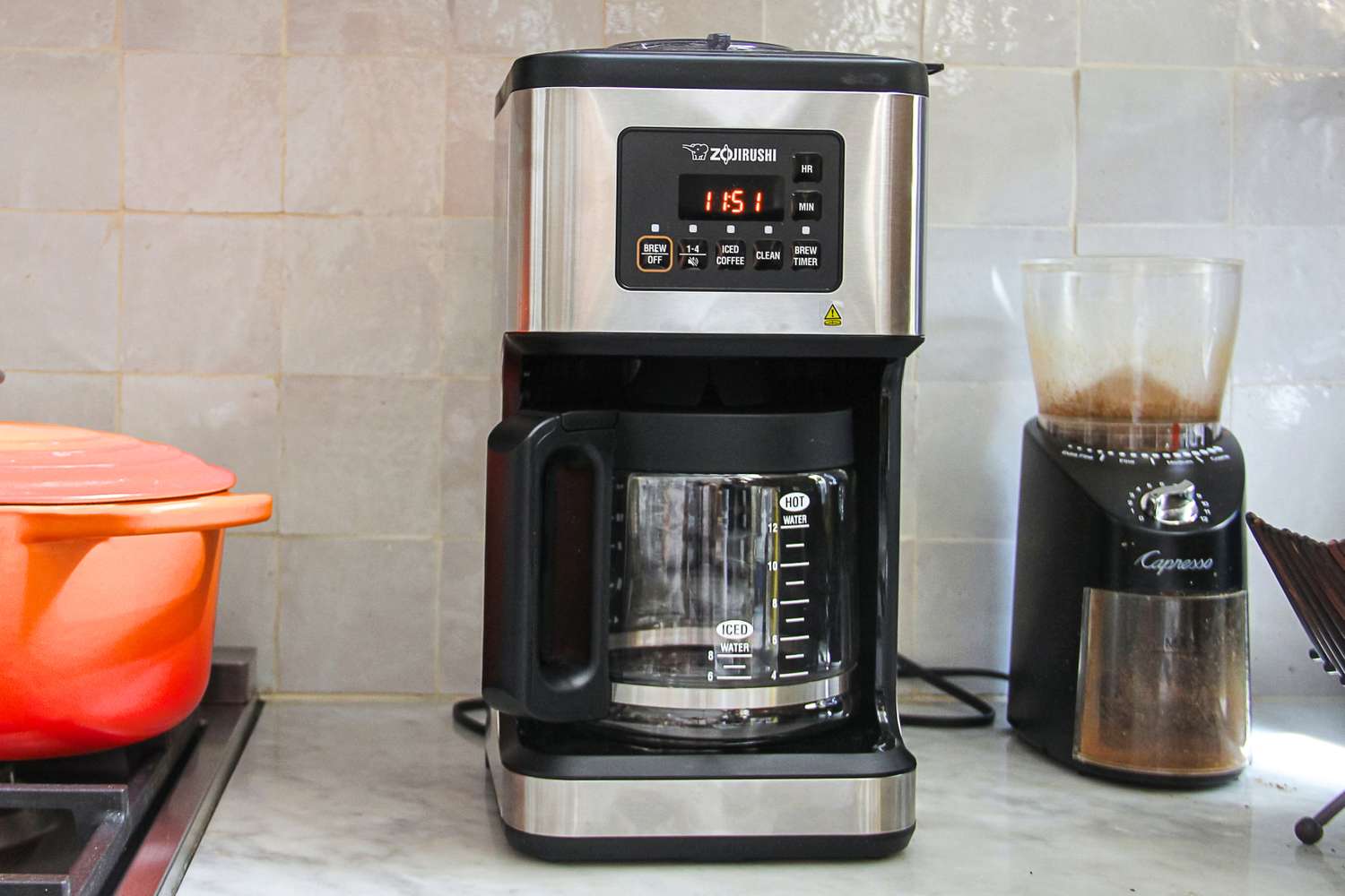 Zojirushi Dome Programmable Coffee Maker on a kitchen countertop alongside a grinder and a cooking pot