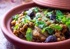 Chicken tagine with chickpeas and figs in an earthenware vessel