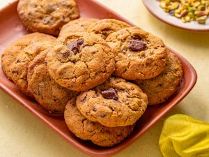 Plate of freshly baked pistachio chocolate chip cookies