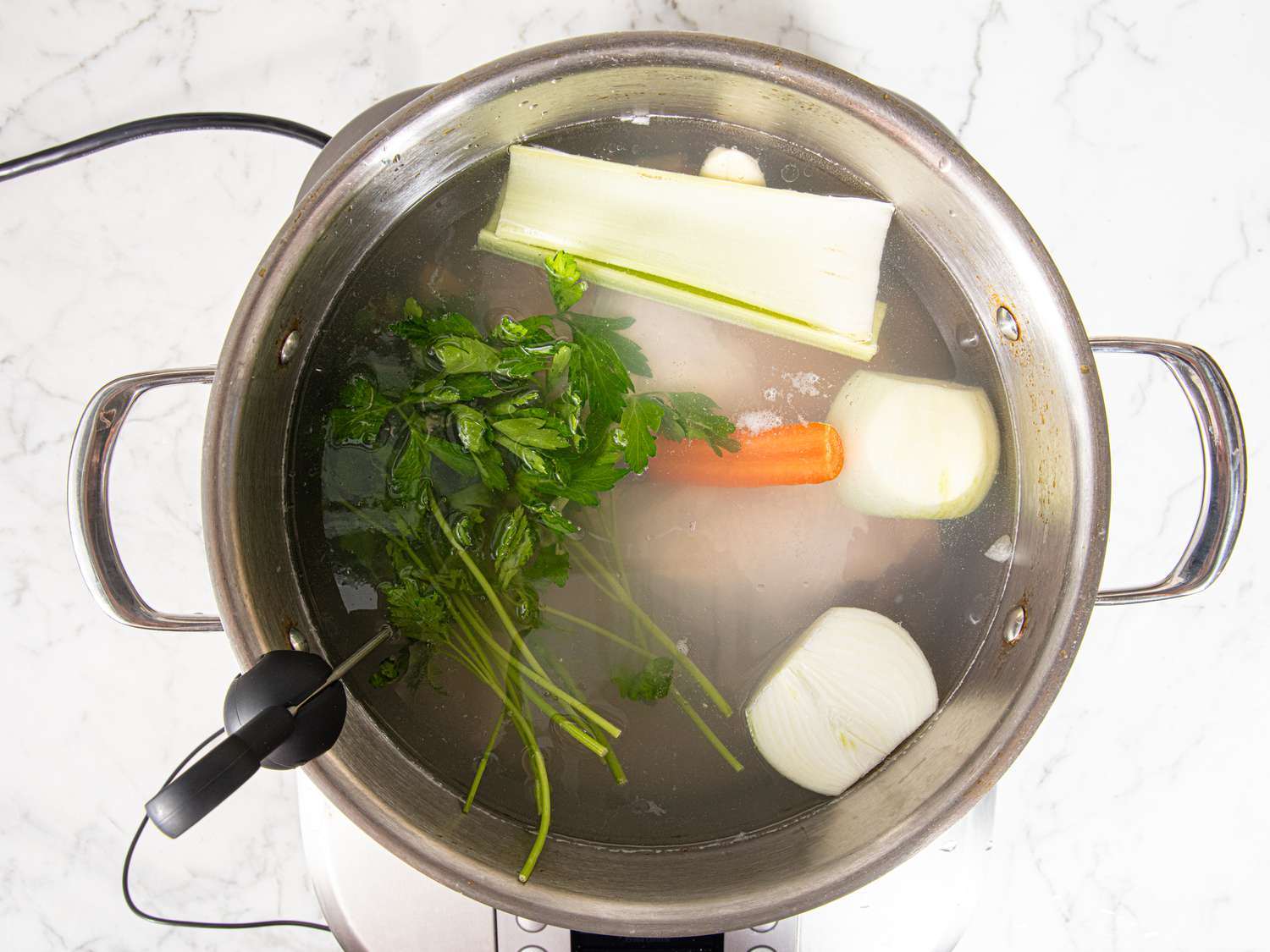 Overhead view of chicken poaching