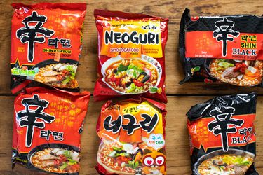 Overhead view of American and Korean versions of Nongshim instant noodles.