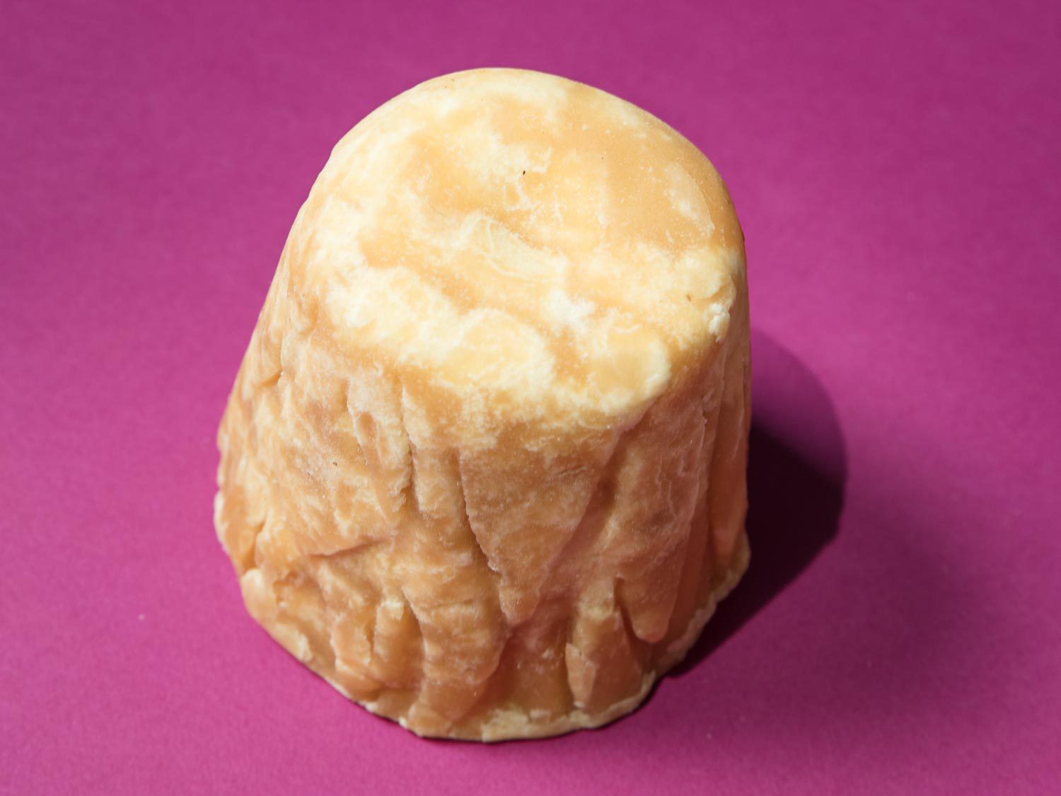 A cylindrical brick of jaggery.