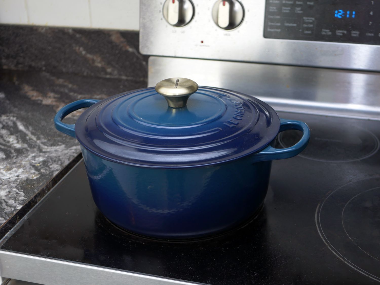 le creuset dutch oven on a stove
