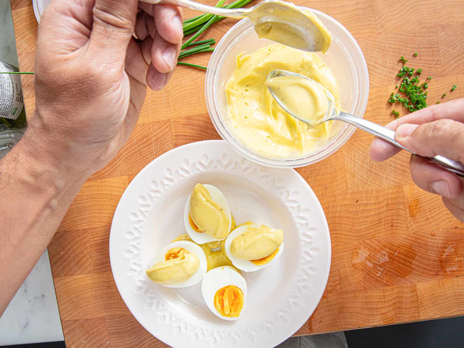 Overhead view of spooning mayo