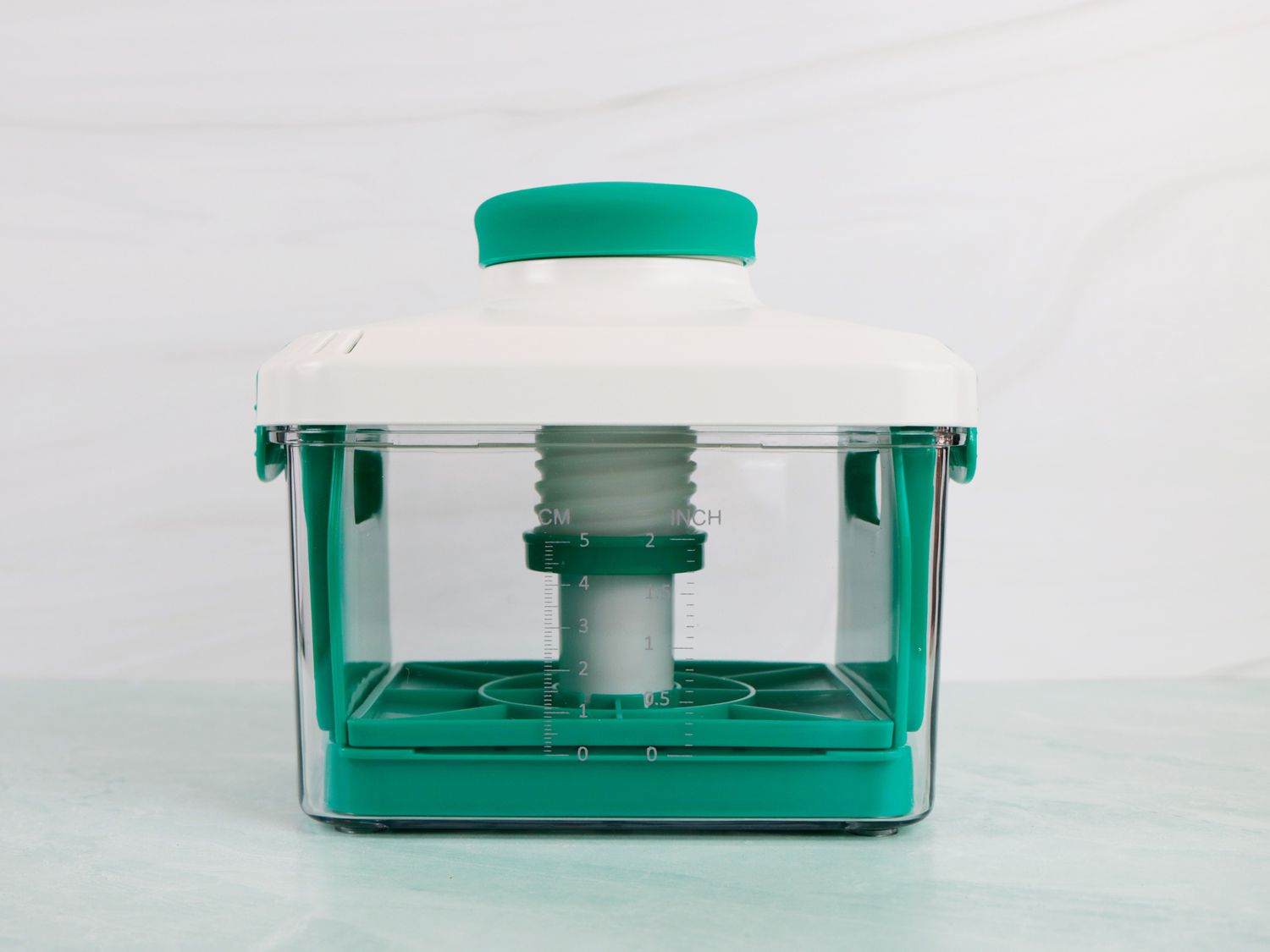 a still shot of the NOYA tofu presse