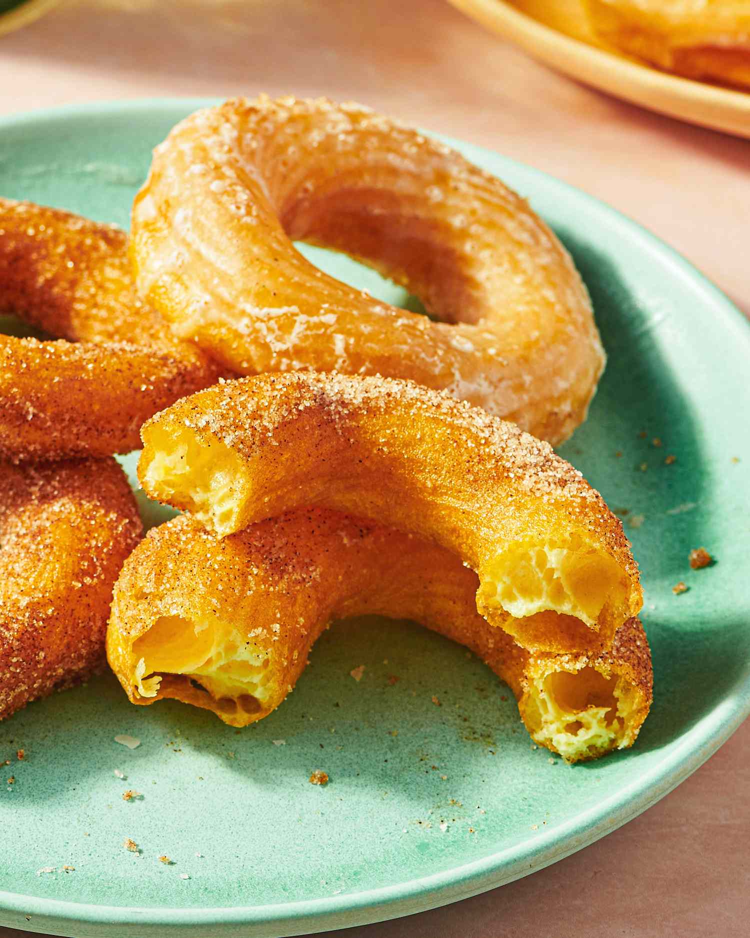 A plate with pieces of French crullers