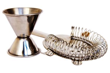 A cocktail jigger and a strainer. 
