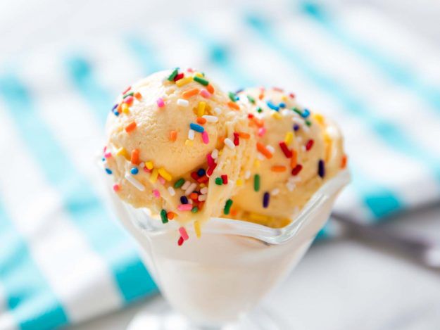 A dish of No-Churn Vanilla Ice Cream with multi-colored sprinkles.