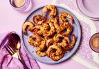 Cajun shrimp on a purple plate.