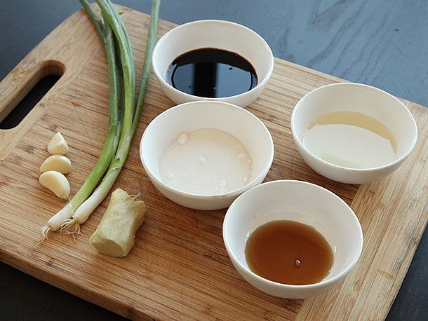 Small white bowls of ingredients for a pork belly marinade