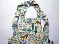 the hedley and bennett smock apron on a white tile surface