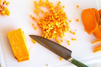 Diced vegetables with a Shun knife on a cutting board