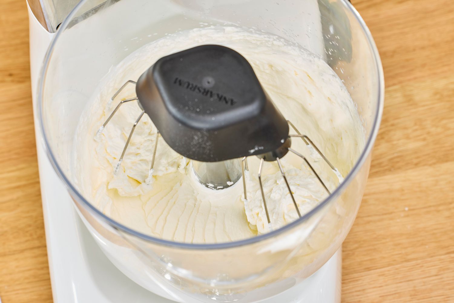 Ankarsrum Stand Mixer mixing whipped cream.