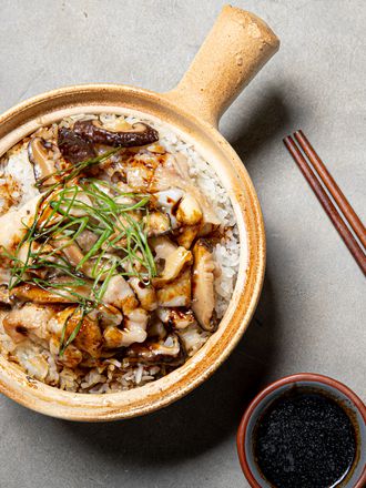 Velveted chicken and mushrooms on top of Cantonese clay pot rice.