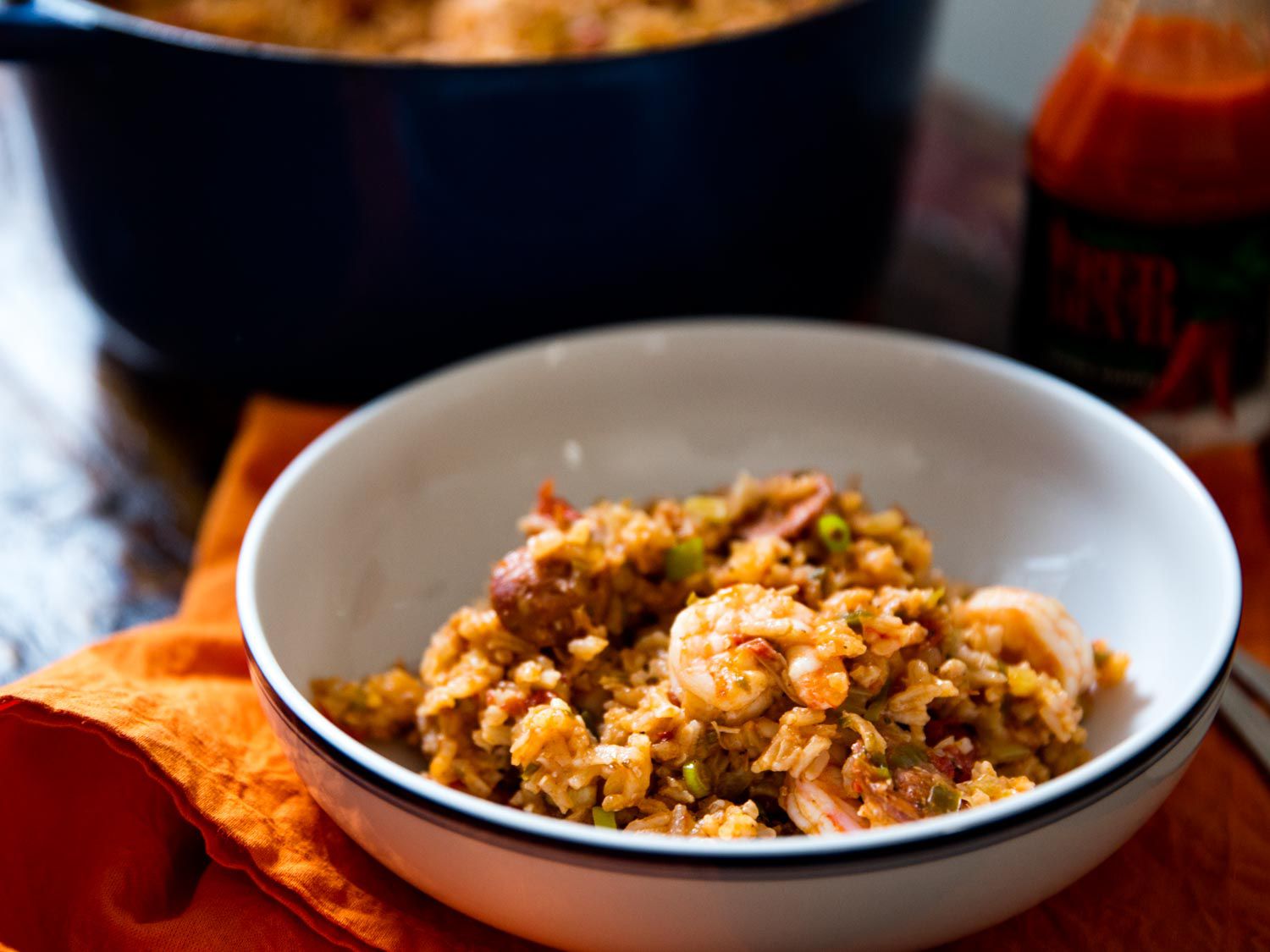 Creole-style jambalaya with chicken, sausage, and shrimp, served in a whit bowl.
