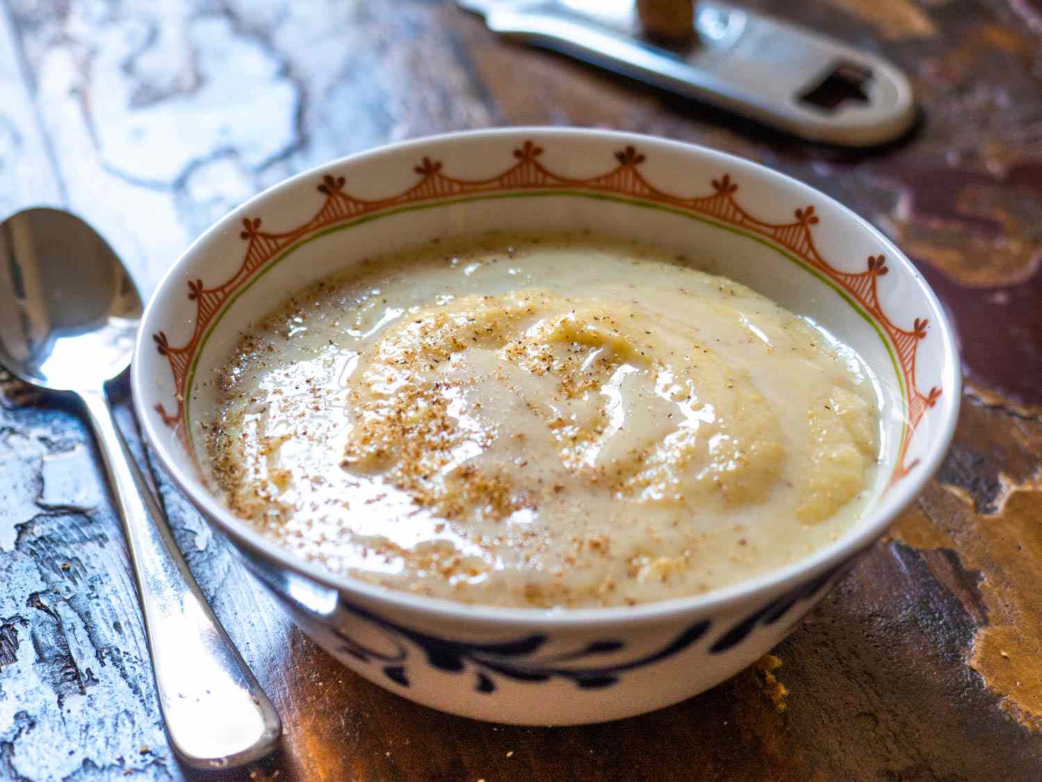 Closeup of Jamaican cornmeal porridge, served in a small bowl.