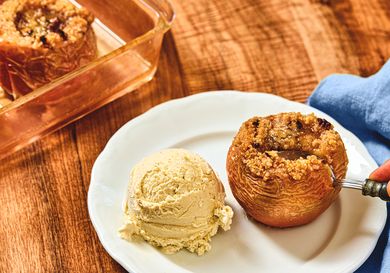 Baked apple served with a scoop of ice cream on a plate dessert prepared for serving