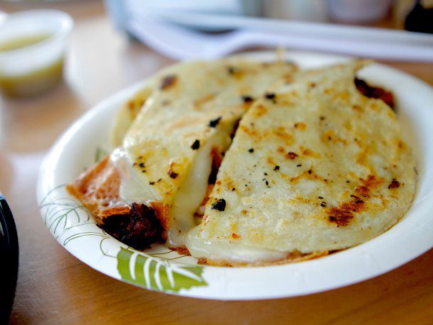 La Super Rica's Quesadilla Pastor on a paper plate.