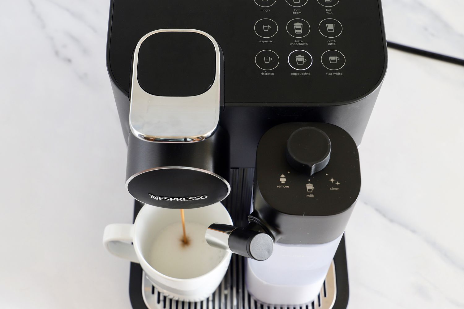 Espresso being dispensed into a mug by the Nespresso Gran Lattissima Original Espresso Machine by De’Longhi