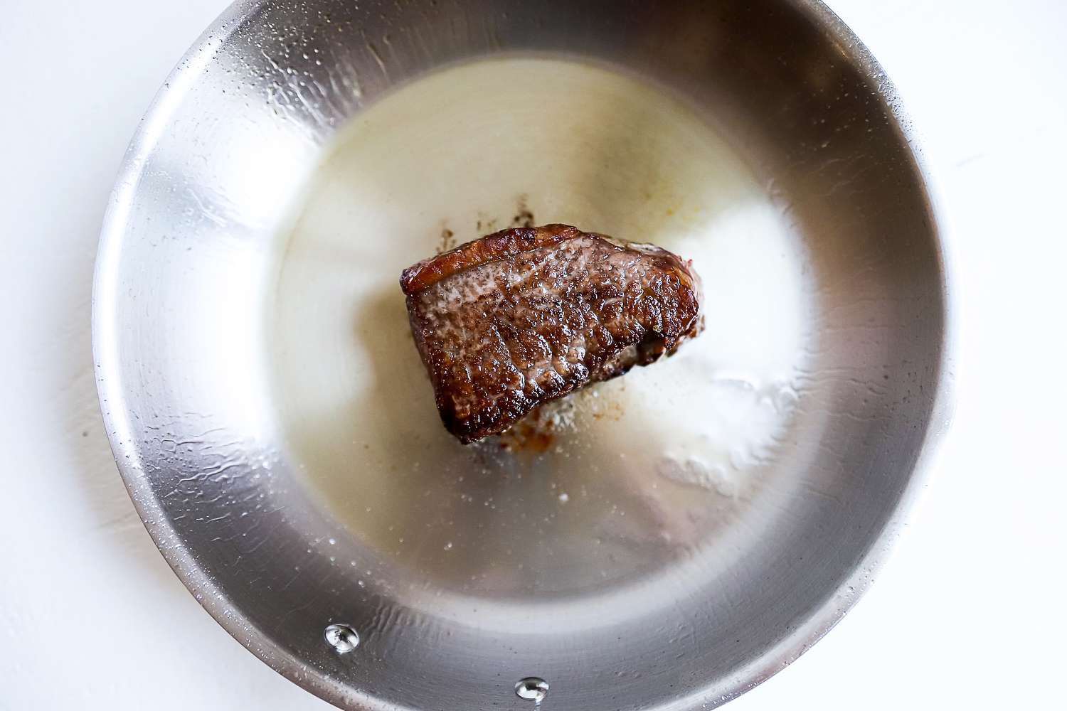 Food cooking in a pan from the Goldilocks 7-piece Cookware Set