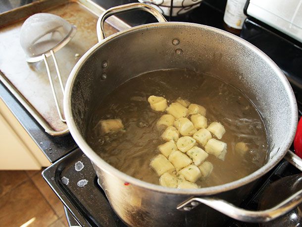 Parisian gnocchi cooking in boiling water. 
