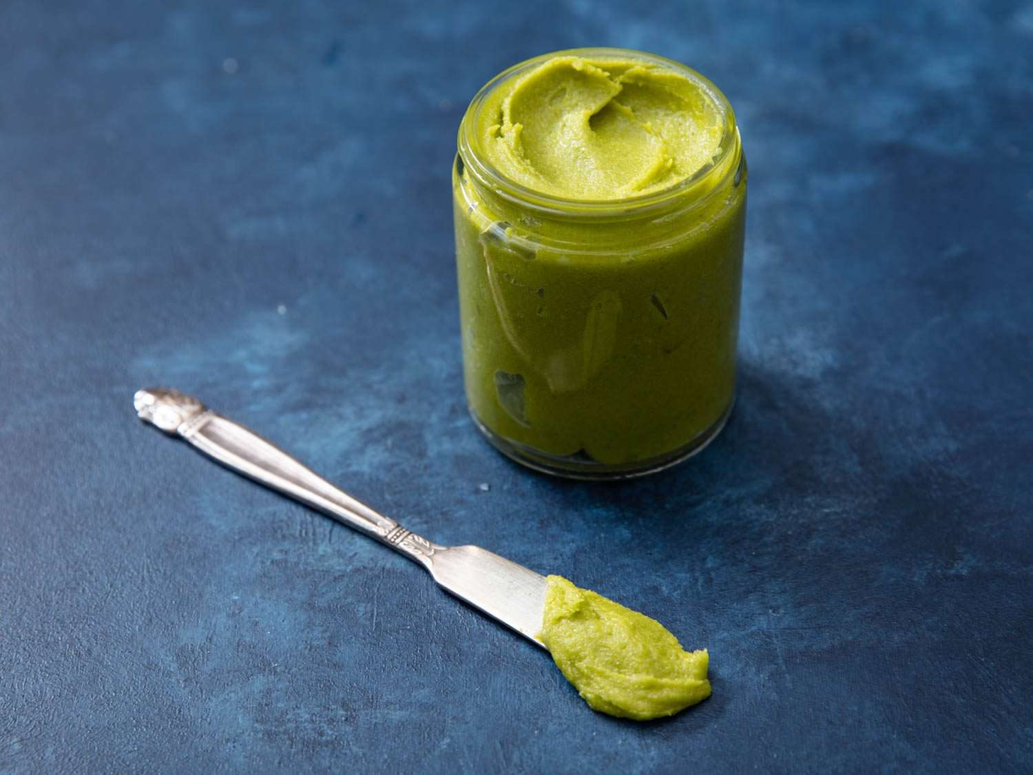 Homemade pistachio paste in a jar.