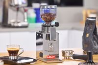 The Lelit Fred Tempo Burr Grinder filled with coffee beans