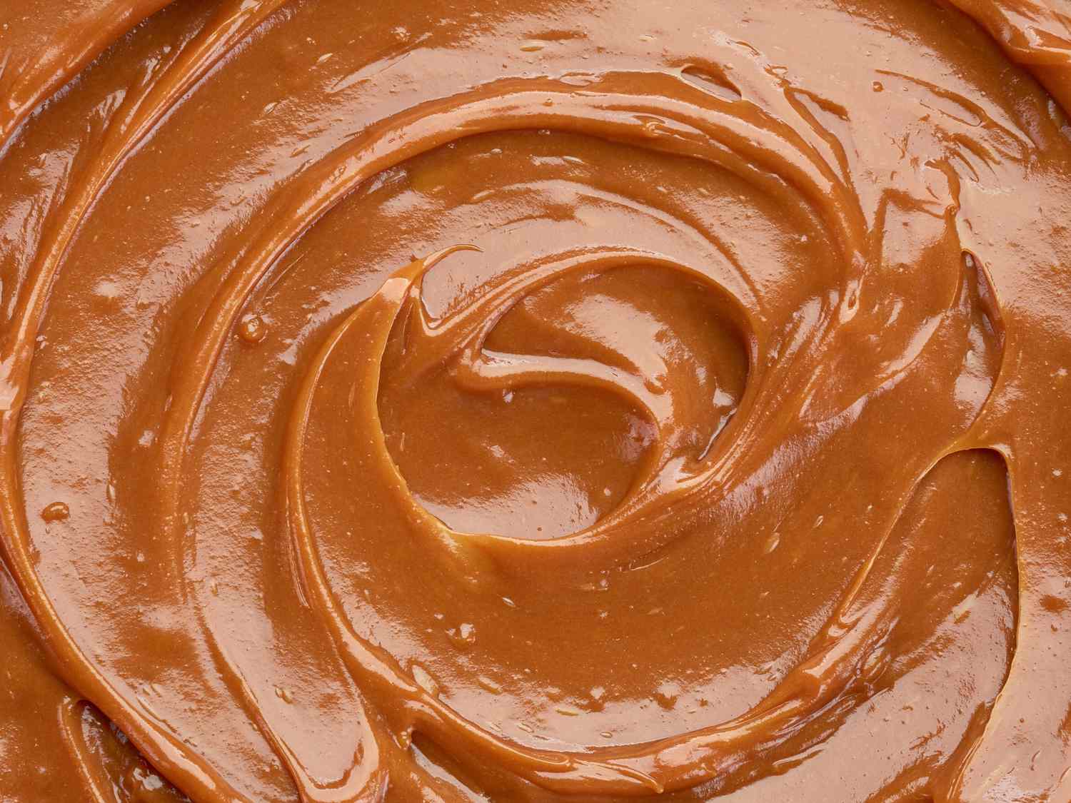 Closeup of a swirl of smooth caramel