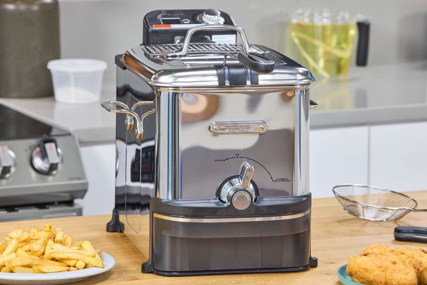 The All-Clad Easy Clean Pro 3.5L Electric Deep Fryer on a kitchen countertop