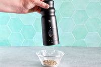 a person using the black rain pepper mill