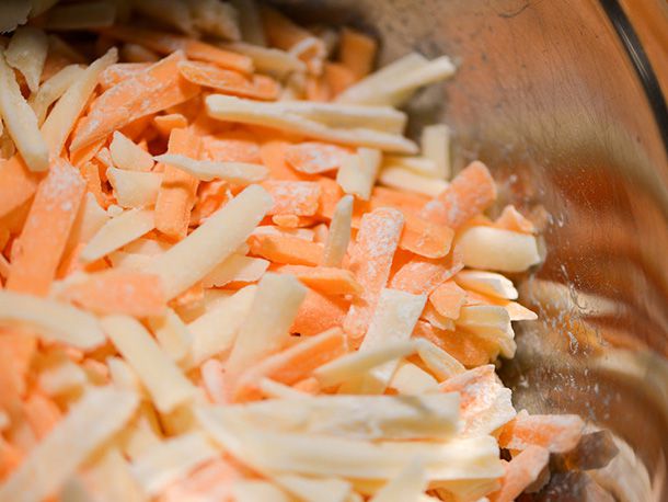 Closeup of shredded cheese coated with cornstarch.