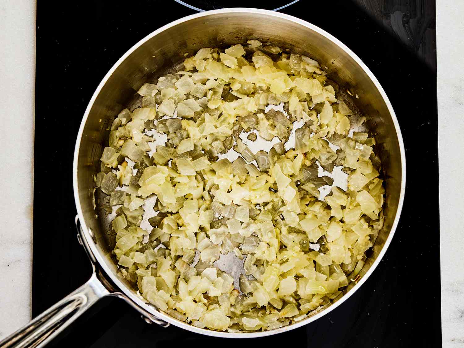 Overhead view of onions cooking 