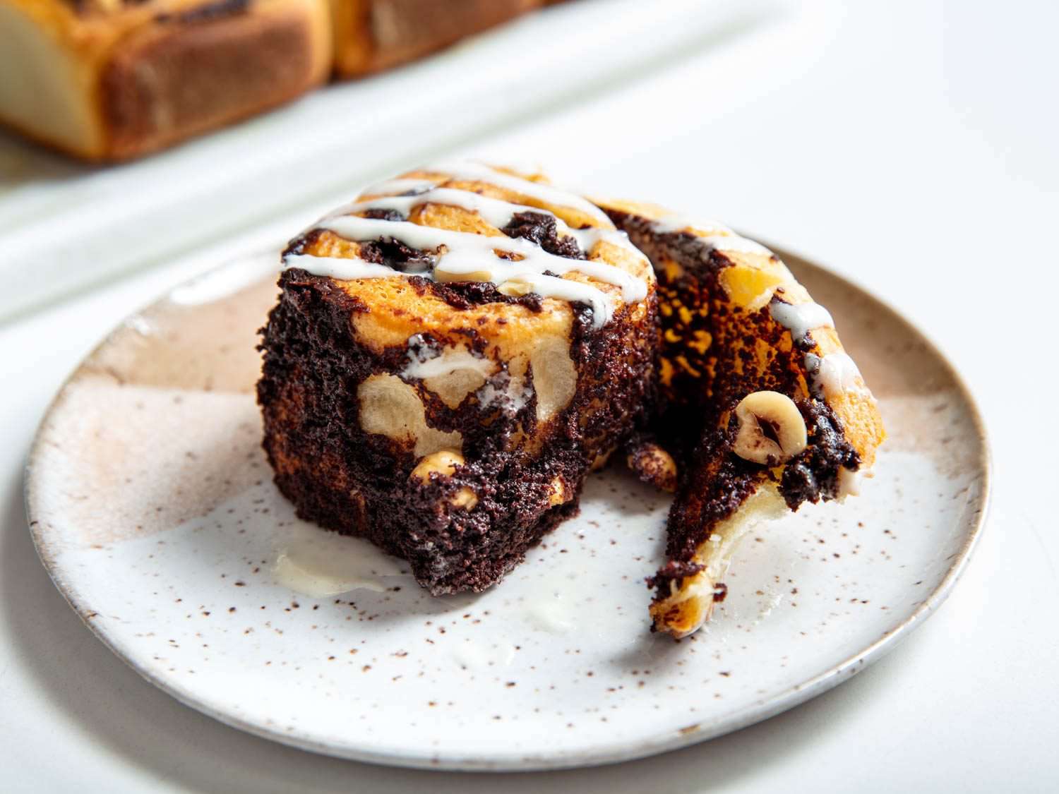 interior of a chocolate hazelnut bun, showing dark layers of Nutella against the soft dough