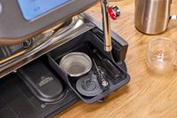 The accessories for the Breville The Oracle Dual Boiler Espresso Machine are stored in a drawer in the base