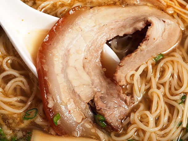 Chashu pork belly resting in a bowl of ramen.
