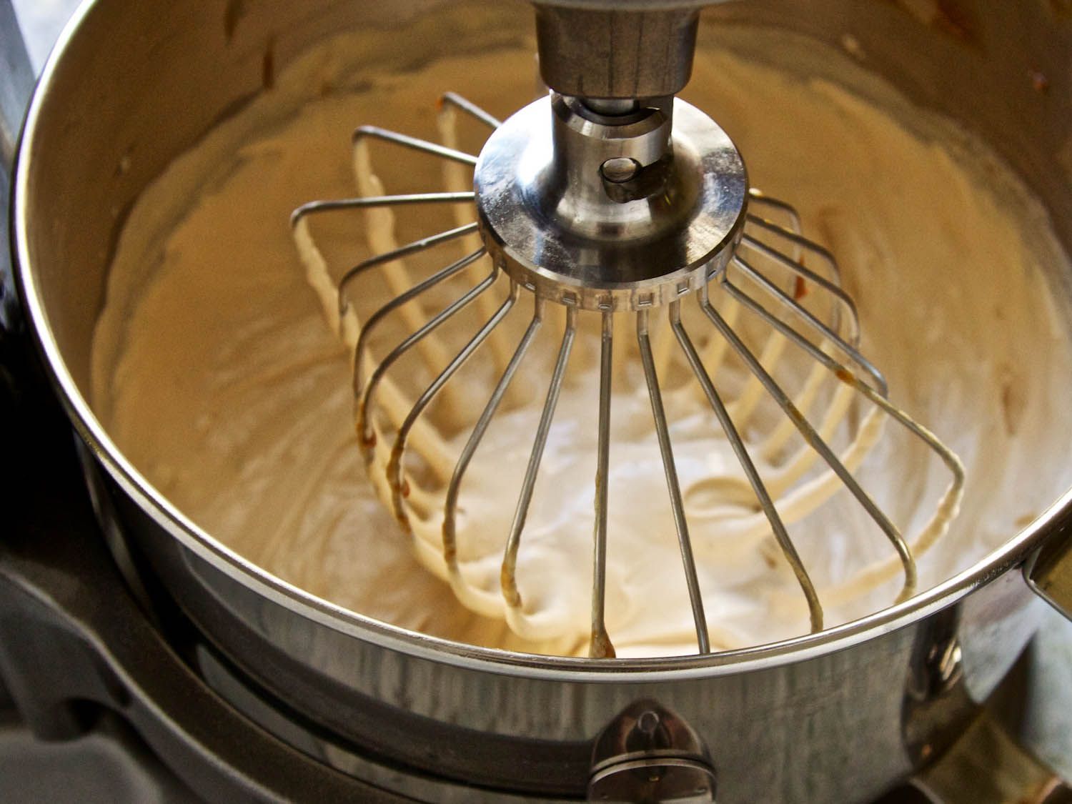 Whisking Snickers pie filling until thick using a whisk attachment in a stand mixer.
