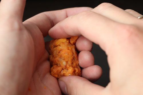 Hand-forming tater tot using the nigirizushi method.
