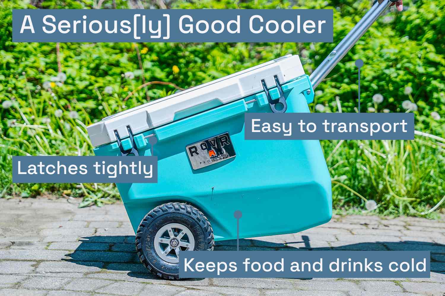 A turquoise wheeled cooler being dragged across a patio.