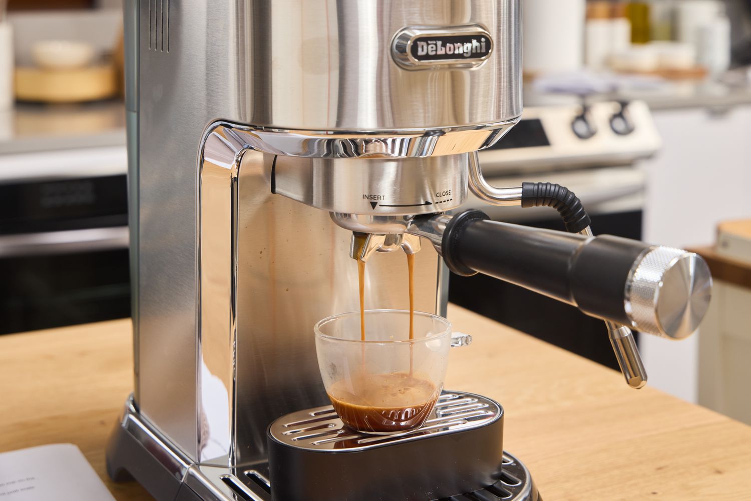 A shot of espresso is made using the De'Longhi EC900M Dedica Maestro Espresso Machine