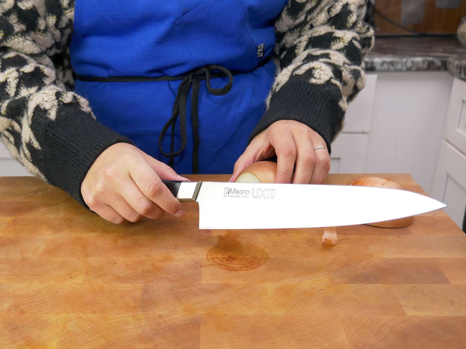 a person holding the misono ux 10