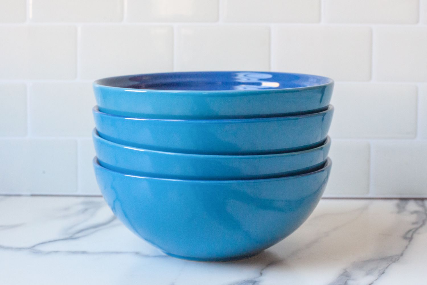 Le Creuset Stoneware Soup Bowl stacked on a counter top