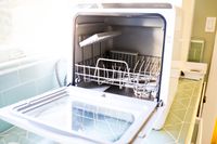 The Hermitlux dishwasher with its door open and empty.