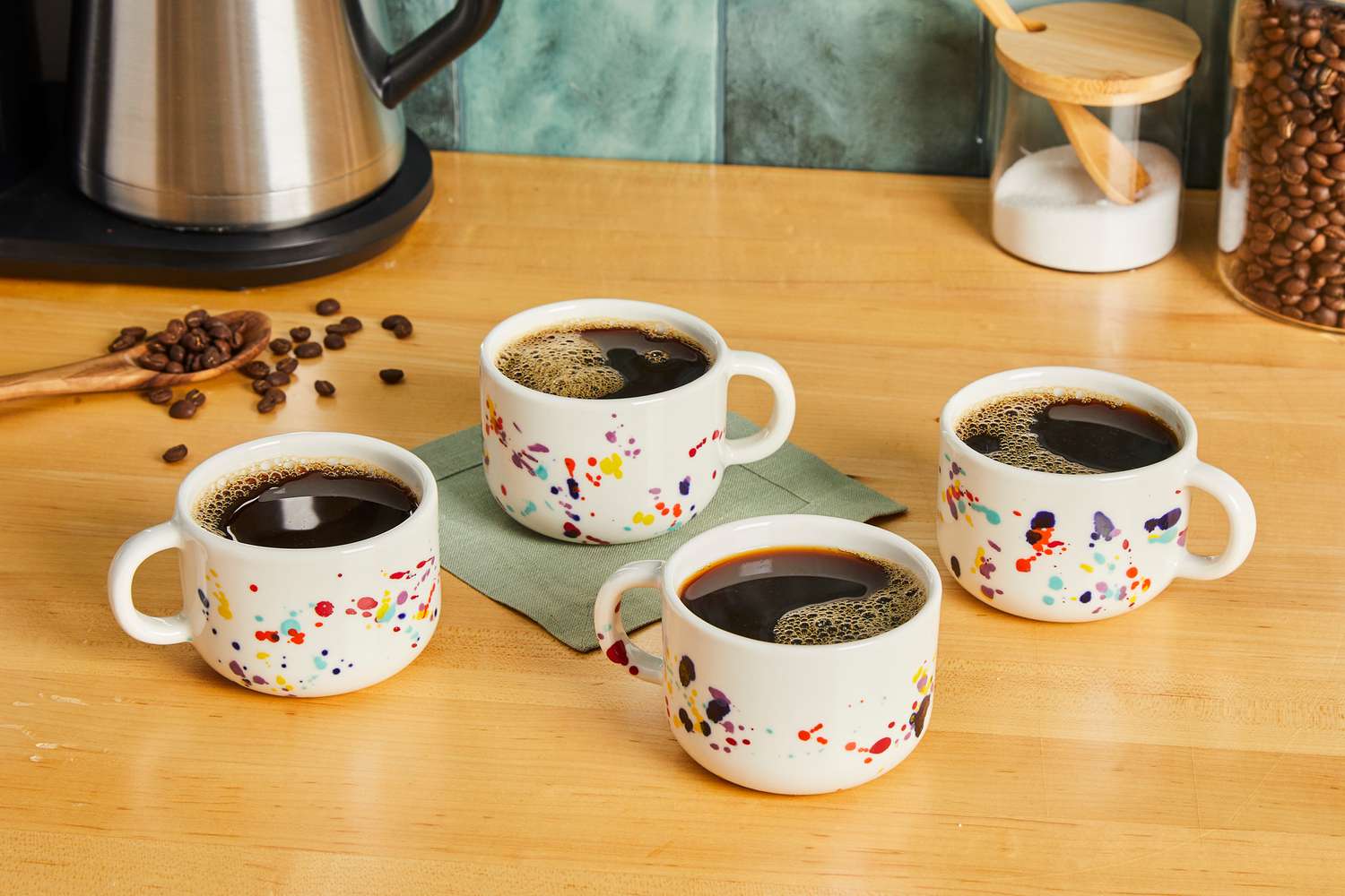 Four Felt + Fat mugs filled with coffee.