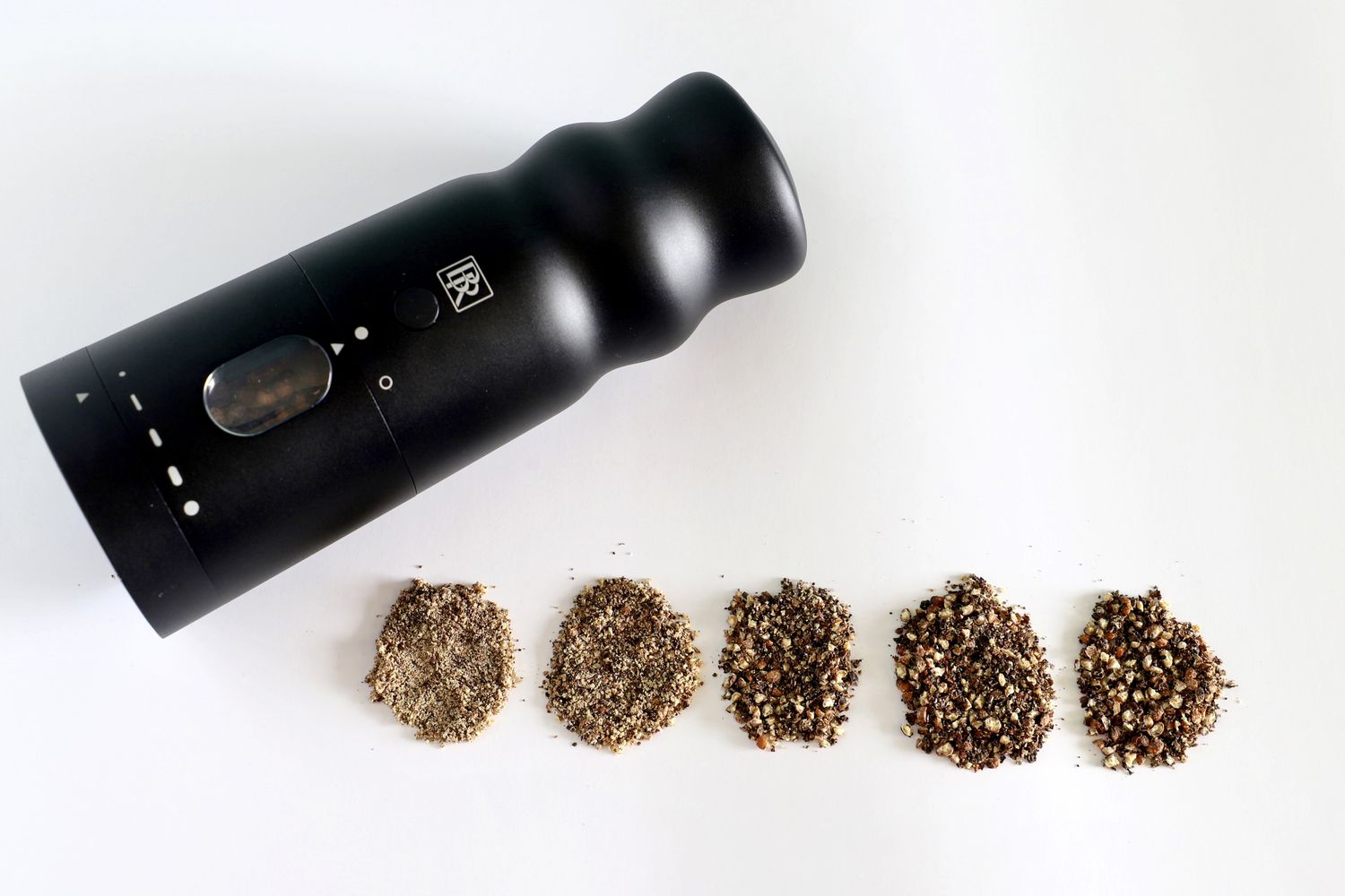 the black rain pepper mill with ground pepper 