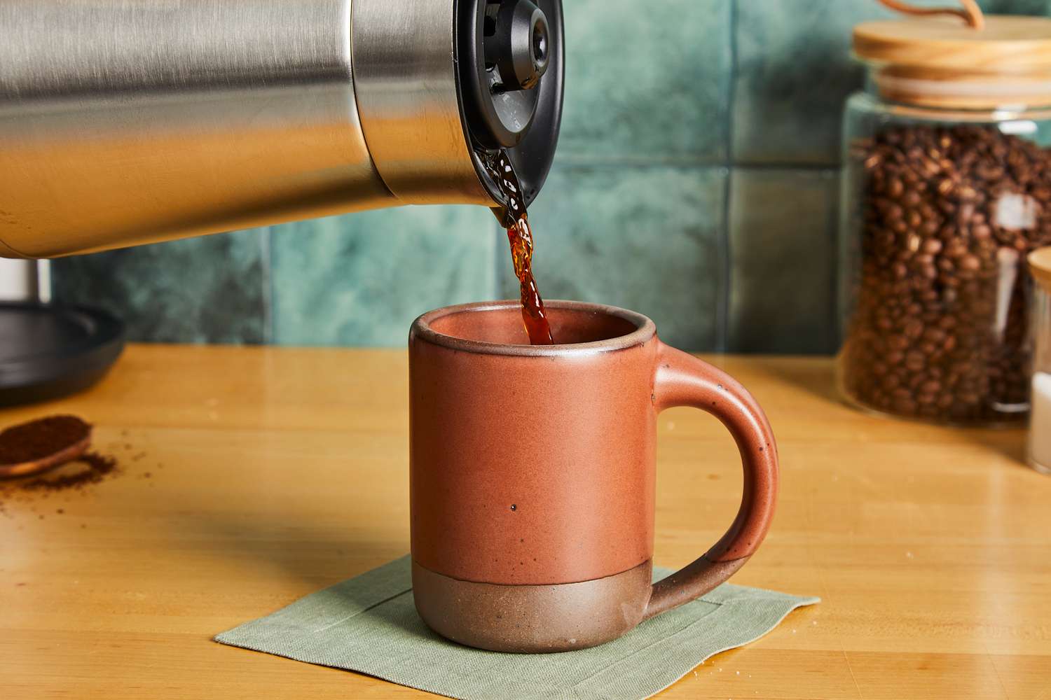 Coffee being poured into an East Fork coffee mug.