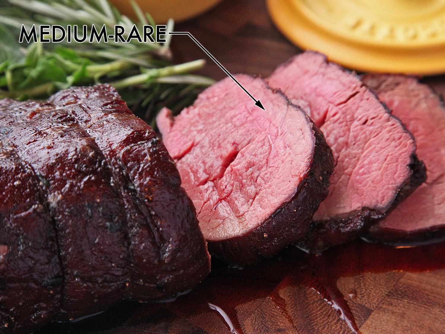 Sliced beef tenderloin roast with medium rare center
