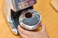 A person assembles the Breville The Smart Grinder Pro