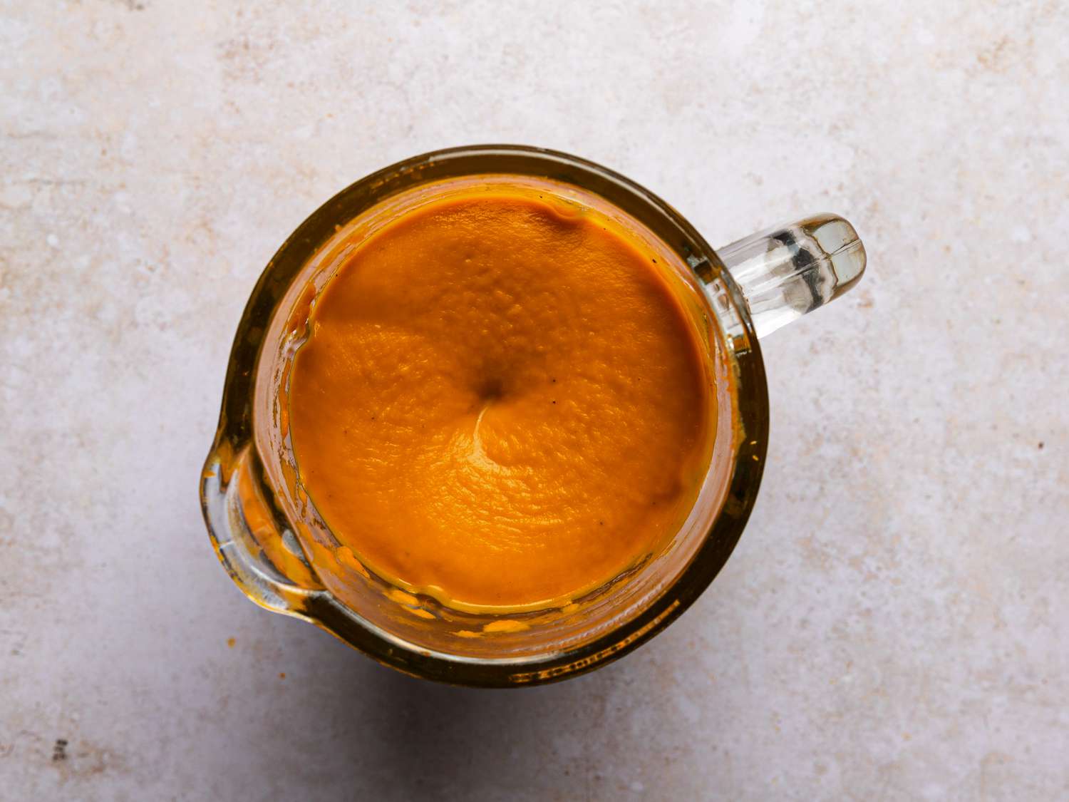 Soup blended until completely smooth inside of a glass blender.